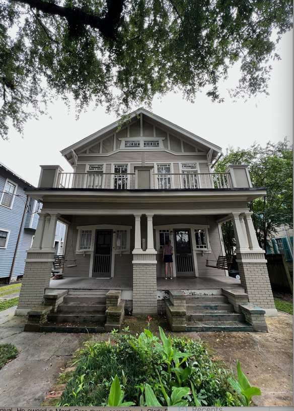 A house with a porch and a couple of people standing in front of it

AI-generated content may be incorrect.